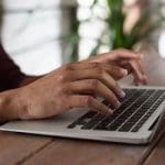 person using macbook 150x150.jpg person using macbook 150x150.jpg